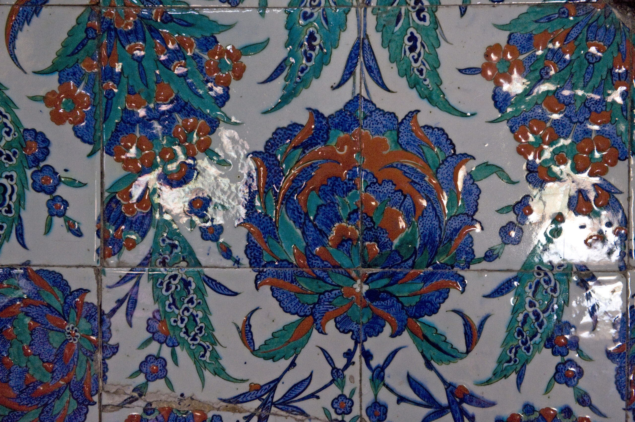 Detail of polychrome ceramic tiles with floral motifs.